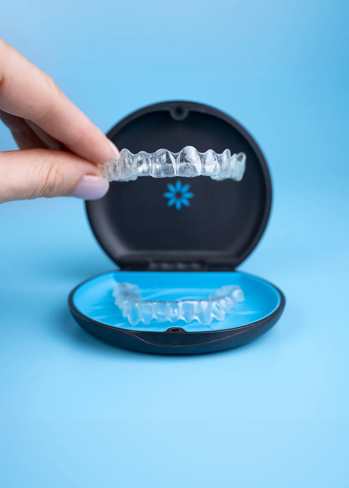 A clear retainer in its open case