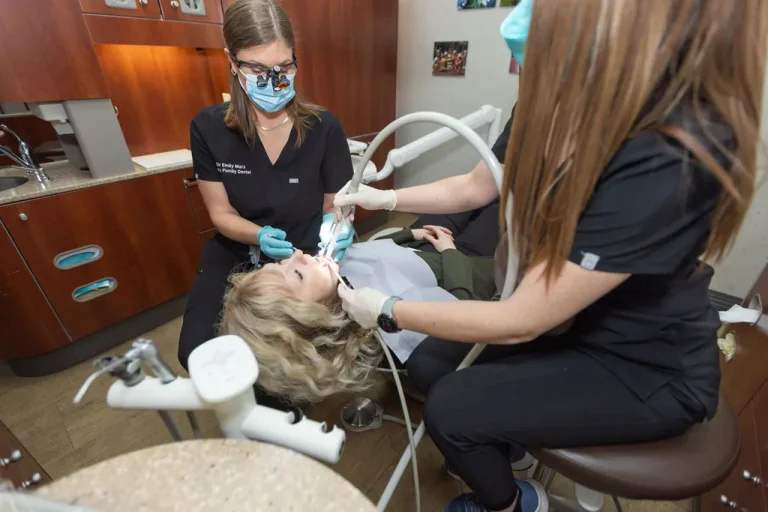 A dentist and assistant treating a patient