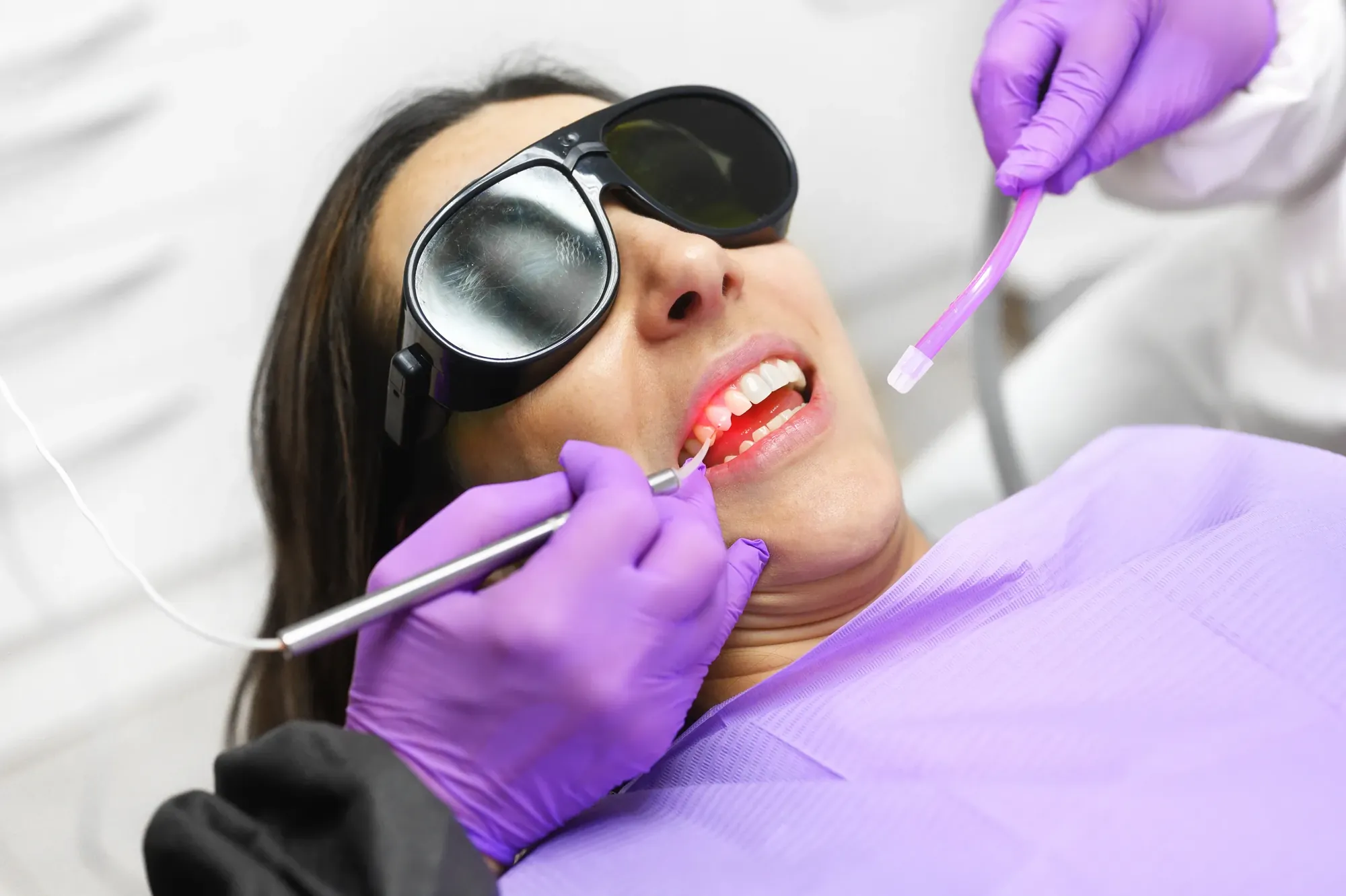 A patient receiving laser gum treatment